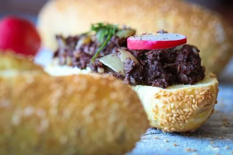 Bread roll with warm kaszanka Stock Photos
