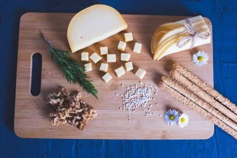 Bread rolls and various cheeses with berries Stock Photos