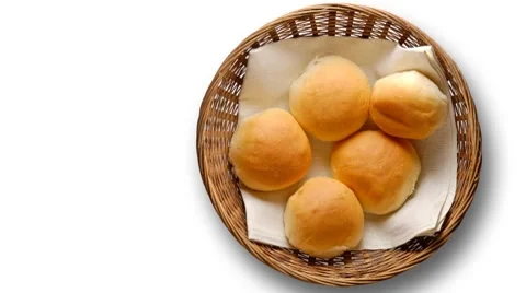 Bread rolls in basket Stockbeeldmateriaal 8833636