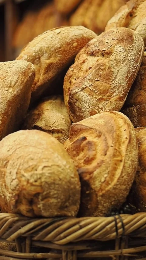 Bread rolls in a basket at a local market in the town Stock Footage 336037269