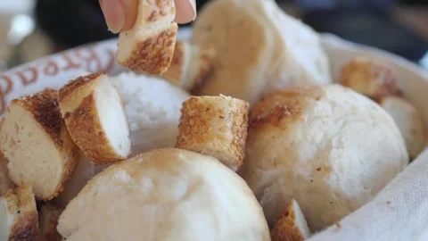 Bread rolls cut into pieces in a basket Stock Footage 345102514