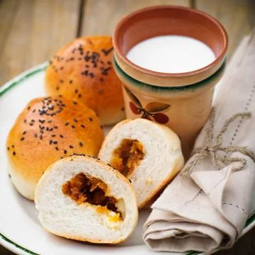Bread Rolls Filled with Pumpkin and Feta with a Cup of Milk Stock Photos