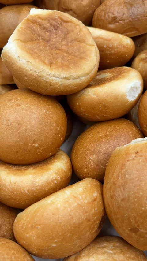 Bread rolls with golden crust closely packed, suitable for bakery concept o.. Stock Footage 318467098