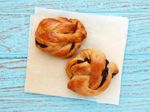 Bread rolls pastry on baking paper Foto stock