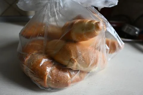 Bread rolls in a plastic bag Stock Photos