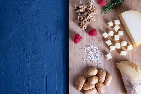 Bread rolls, sliced cheese with berries Stock Photos
