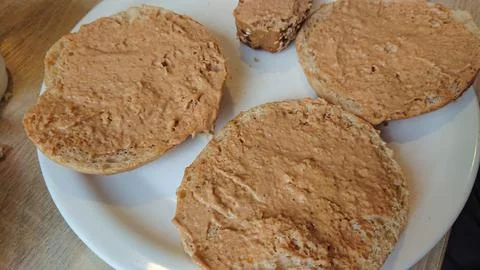 Bread rolls with spread on a plate Stock Photos