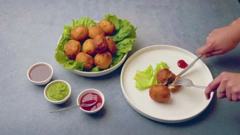 Bread rolls stuffed with potatoes served with green and red sauces Stock Footage 149645161