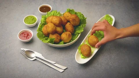 Bread rolls stuffed with potatoes served with green and red sauces Stock Footage 149645167