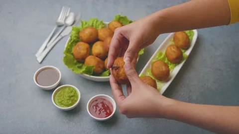 Bread rolls stuffed with potatoes served with green and red sauces Stock Footage 149645171