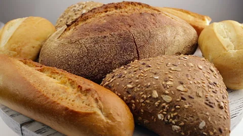 Bread in the rotating basket on a table. Loop Video stock 61893278