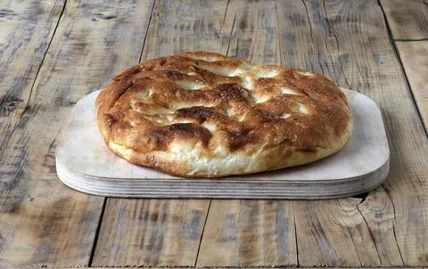 Bread round thin on the table close-up. Stock Photos