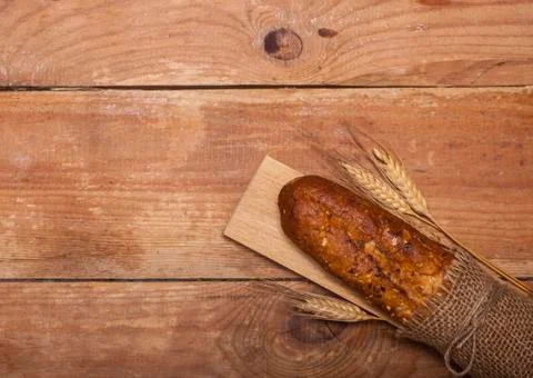 Bread on rustic wooden table Stock Photos