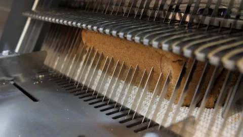 Bread sclicing machine at the manufacturing. Bread slicing Stock Footage 131826436