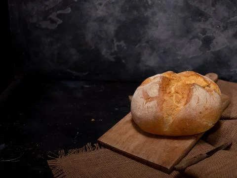 Bread with seeds on a beach concrete background Foto stock