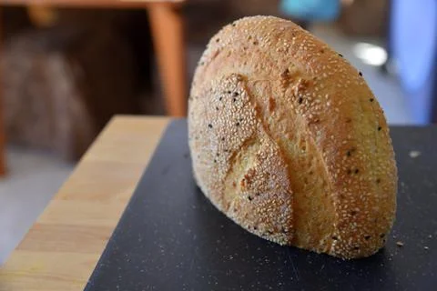 Bread with seeds on cutting board Stock Photos