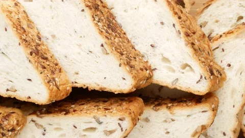 Bread with seeds sliced, dolly shot. Stock Footage 147398069