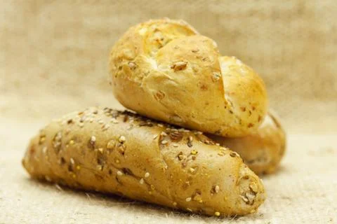 Bread with seeds  in a wicker mat Stock Photos