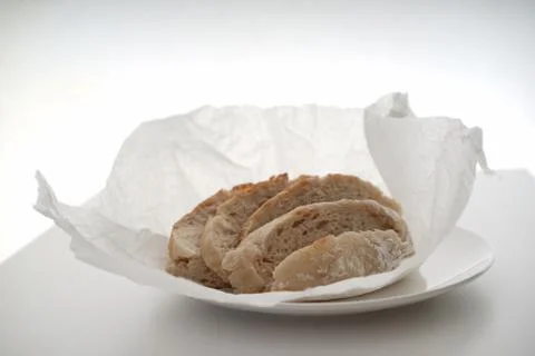 Bread served on a white table. Fotos Stock