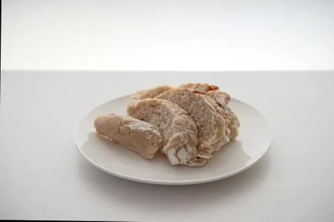 Bread served on a white table. Stock Photos