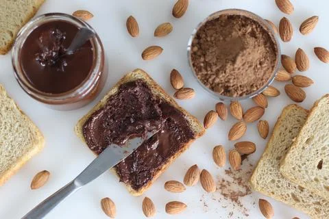 Bread slice with almond chocolate spread, a heavenly blend of rich almonds .. Stock Photos