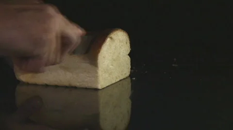 Bread slice being cut from loaf Stock Footage 107743