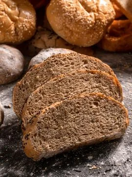 Bread slice on the black wooden table Stock Photos