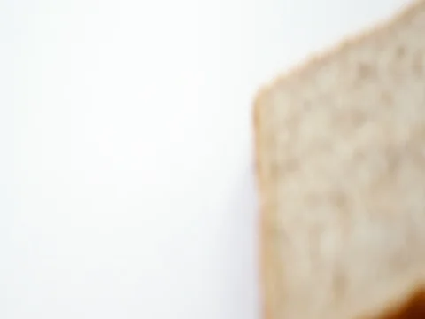 Bread slice with broken edge on white background Stock Footage 75462148