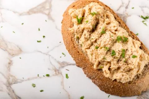 Bread slice with cream made from mashed chicken breast with herbs and groun.. Stock Photos