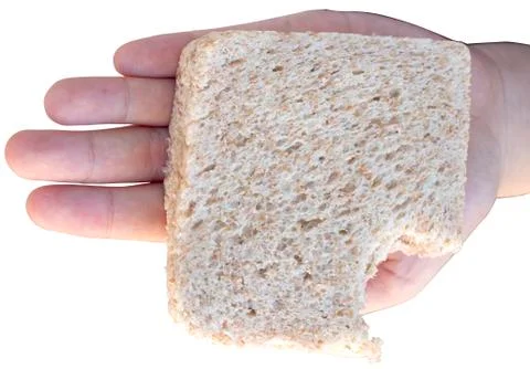 Bread slice on hand isolated on white background. Stock Photos