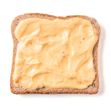 Bread slice with mustard sauce isolated on white Foto stock
