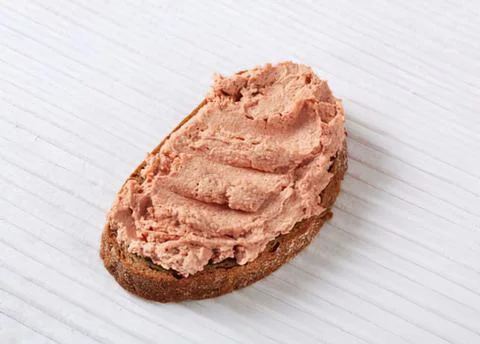 Bread slice topped with pink salmon spread 写真素材