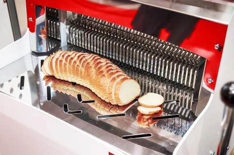 Bread slicer with big loaf Stock Photos