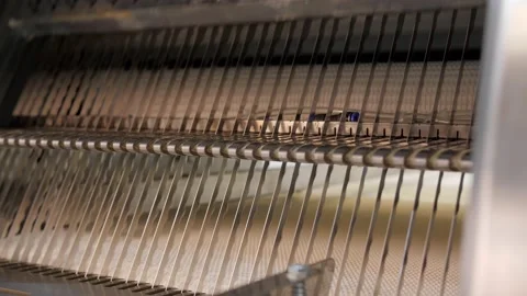 Bread slicer in factory. Sharp knives for factory bread cutting Stock Footage 131822680