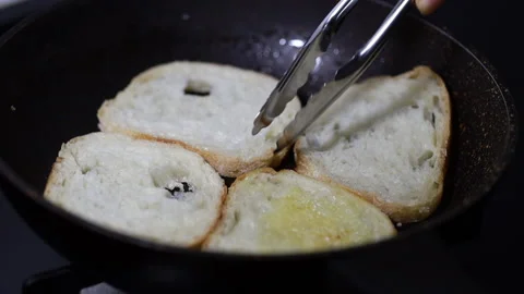 Bread slices being toasted in a pan Stock Footage 160140082