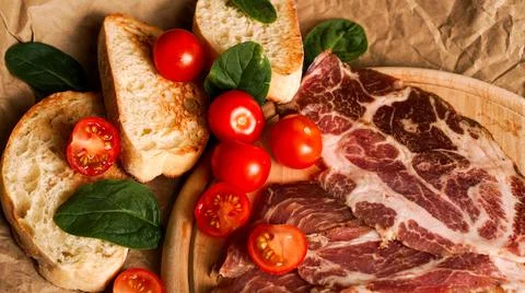 Bread slices, cherry tomatoes, spinach and ham. Ingredients Stock Photos