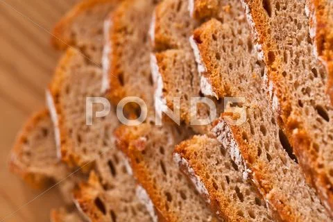 Bread slices of dark bread Stock Photos