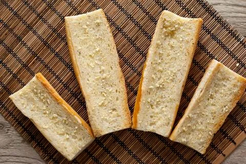 Bread slices with garlic spread Stock Photos