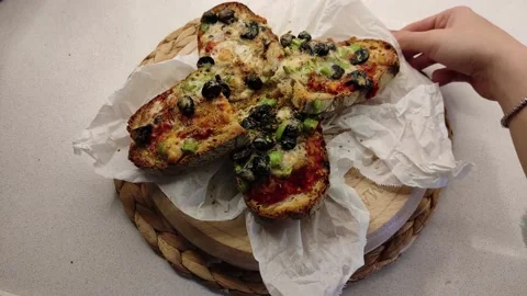 Bread Slices with lots of Sauce on a Rotating Wooden Board 2 Stock Footage 144045283