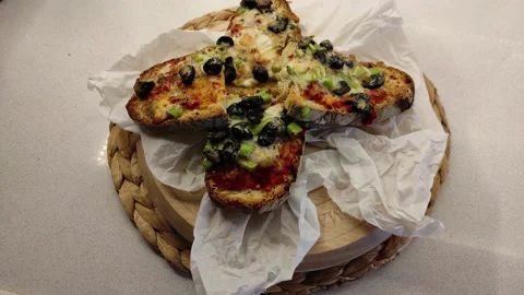 Bread Slices with lots of Sauce on a Rotating Wooden Board 3 Stock Footage 144045337