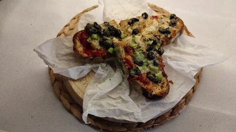 Bread Slices with lots of Sauce on a Rotating Wooden Board 5 Stock Footage 144045650