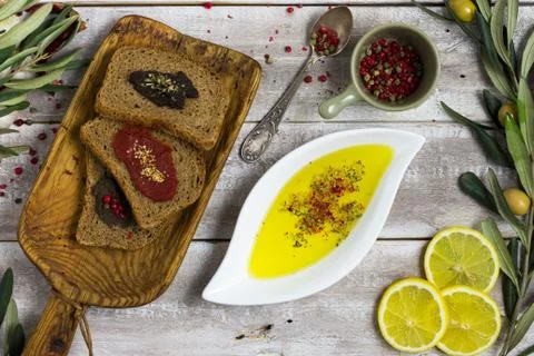 Bread slices, olive oil flat lay shot Stock Photos