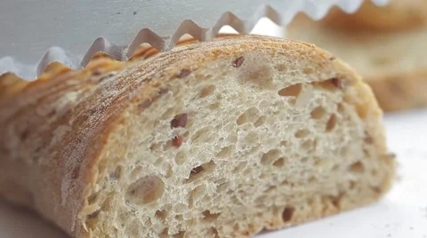 Bread slicing. Fresh bakery loaf and slices on white background. Macro shot. Stock Footage 50363035