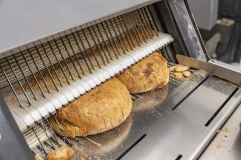 Bread slicing machine. Stock Photos