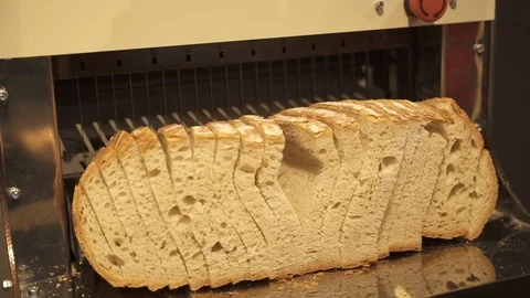 Bread slicing machine in works Slog Stock Footage 127364036