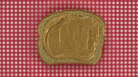 Bread smeared with peanut butter and chocolate Stock Footage 231504888