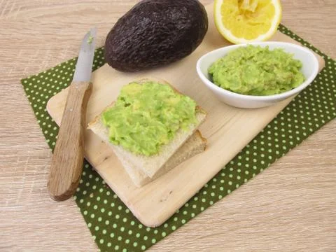 Bread spread from avocado and lemon on sandwich toast Stock Photos