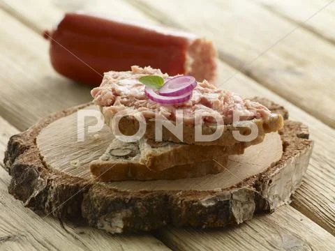 Bread spread with Teewurst and onions Stock Photos
