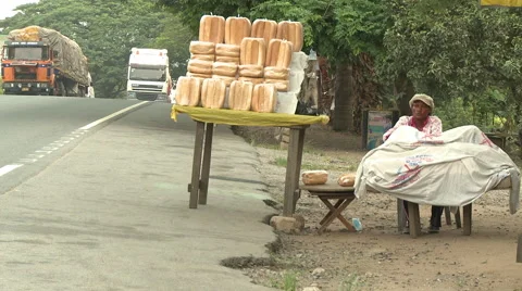 BREAD STAND NEXT TO BUSY ROAD Stock Footage 60633246
