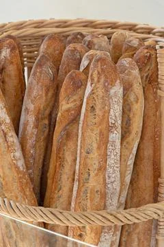 Bread sticks in a basket Stock Photos